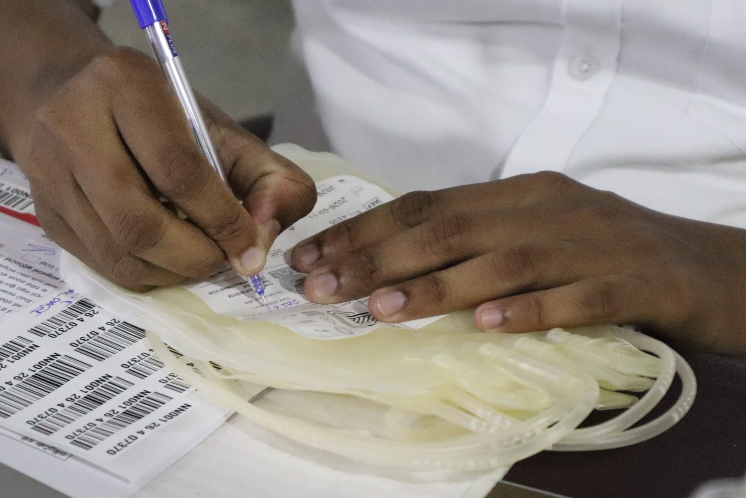 Medical officer labeling donated blood bag during the Vimukthi Foundation quarterly blood donation drive